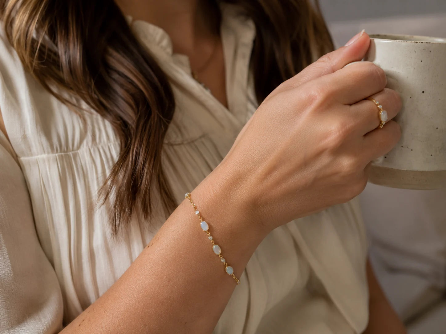 Customer-style photo wearing a delicate opal bracelet